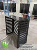Black louvered aluminum air conditioner cover with modern horizontal slats for HVAC protection